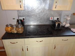 a kitchen counter top with a stove top oven at 42 Kilmuir in Dunvegan