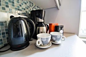 Kahvin ja teen valmistusvälineet majoituspaikassa Business Class Ruterra Suite