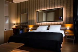 Postel nebo postele na pokoji v ubytování B&B Wimbledon Garni Concept