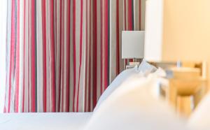 Postel nebo postele na pokoji v ubytování Alkion Hotel