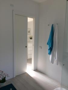 an open door to a room with a hallway at Appartamento Al Bianco Convento in Venice-Lido +40 photos