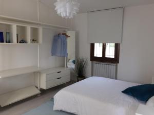 מיטה או מיטות בחדר ב-Holiday home Bianco Convento