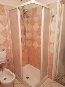 a shower stall in a bathroom with a toilet at La Casetta Di Via Fara in Manoppello