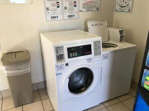 a washer and dryer in a room at Motel 6-Lakeland, FL in Lakeland