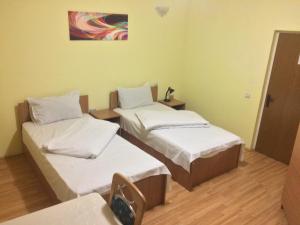 Postel nebo postele na pokoji v ubytování Pensiunea Residence