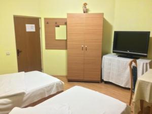 Postel nebo postele na pokoji v ubytování Pensiunea Residence