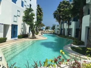 a swimming pool in the middle of a building at The Crest Santora by Wanida monthly rate in Hua Hin