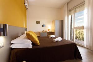 Postel nebo postele na pokoji v ubytování Hotel Antares
