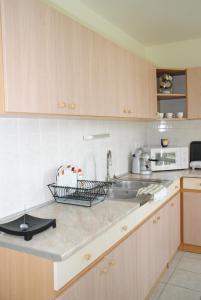 Kuchyňa alebo kuchynka v ubytovaní Szamóca Apartman