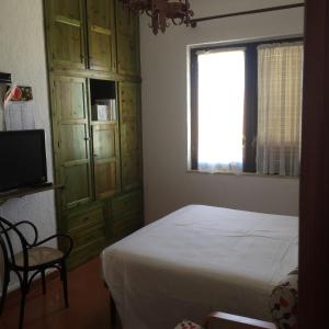 Ένα ή περισσότερα κρεβάτια σε δωμάτιο στο Casa appartamento