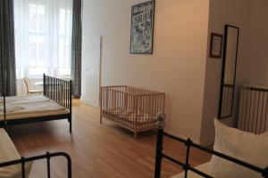 Postel nebo postele na pokoji v ubytování Hotel Pension Waizenegger am Kurfürstendamm