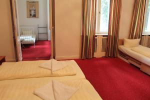 Postel nebo postele na pokoji v ubytování Hotel Pension Kima