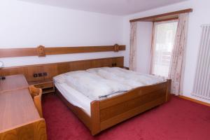 Ein Bett oder Betten in einem Zimmer der Unterkunft Monte Rosa