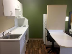 a small kitchen with a sink and a refrigerator at Extended Stay America Suites - Detroit - Ann Arbor - Briarwood Mall in Ann Arbor