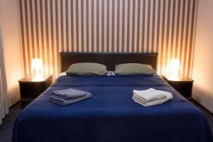 En eller flere senge i et værelse på Boutique Hotel Akvatorya