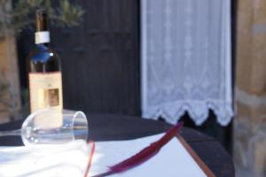 a bottle of wine sitting on top of a table at Carpe Diem in Navaridas