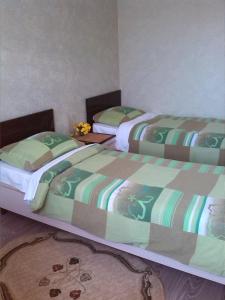 Cama o camas de una habitación en Guest House on Festivalnaya