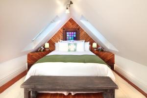 Ένα ή περισσότερα κρεβάτια σε δωμάτιο στο The Grape Leaf Inn