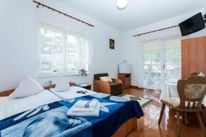 Postel nebo postele na pokoji v ubytování Villa Ula