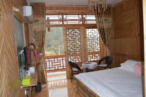 Cama o camas de una habitación en Yangjiajie Inn