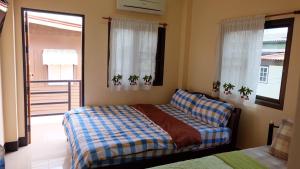 Postel nebo postele na pokoji v ubytování Benya Guest House + 37 fotografií