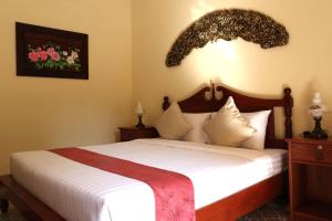 Postel nebo postele na pokoji v ubytování Le Jardin Hotel