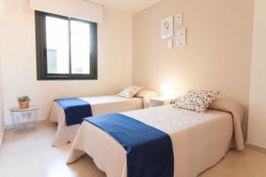 Posteľ alebo postele v izbe v ubytovaní Malaga Center Flat Holidays Atarazanas Market