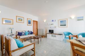 TV a/nebo společenská místnost v ubytování Casa Sul Mare con Vista Mozzafiato