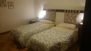 Postel nebo postele na pokoji v ubytování B&B IN FATTORIA