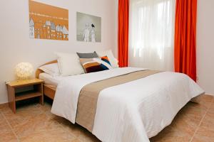 Postel nebo postele na pokoji v ubytování Apartments Villa Adria Bol
