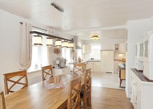 a kitchen and dining room with a table and chairs at Feriendomizil Erzgebirge in Marienberg