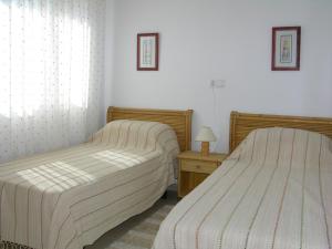 Łóżko lub łóżka w pokoju w obiekcie Ribera Beach 3 - 1208
