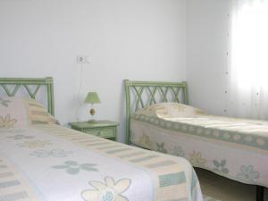 Łóżko lub łóżka w pokoju w obiekcie Ribera Beach 3 - 1208