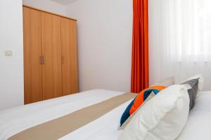 Postel nebo postele na pokoji v ubytování Apartments Villa Adria Bol