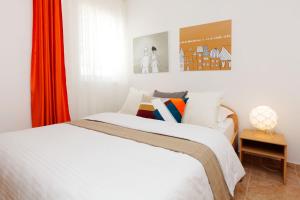 Postel nebo postele na pokoji v ubytování Apartments Villa Adria Bol