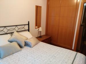 Iradri, Apartamento Playa Gijón tesisinde bir odada yatak veya yataklar