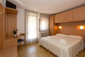 Postel nebo postele na pokoji v ubytování Hotel Cima Tosa