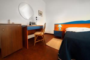 Tempat tidur dalam kamar di B & B Brisa del Mar