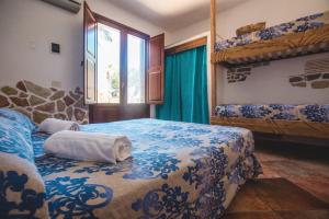 a bedroom with two bunk beds and a window at Villa Di Maria in San Vito lo Capo +169 photos