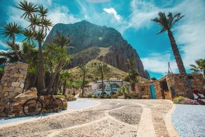 a bike parked in front of a mountain at Villa Di Maria in San Vito lo Capo