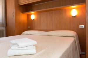 Postel nebo postele na pokoji v ubytování Hotel Cima Tosa