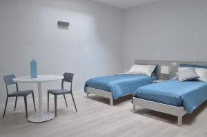 A bed or beds in a room at Trani Rent Rooms