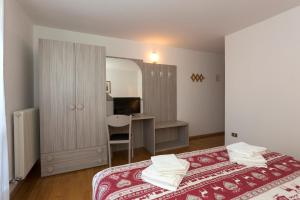 Postel nebo postele na pokoji v ubytování Hotel Cima Tosa