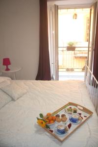 a tray of food on top of a bed at Hello World in Agrigento