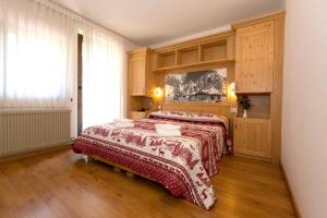 Ένα ή περισσότερα κρεβάτια σε δωμάτιο στο Hotel Cima Tosa