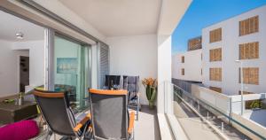 an apartment balcony with chairs and a table at Bepo Luxury Apartments in Split