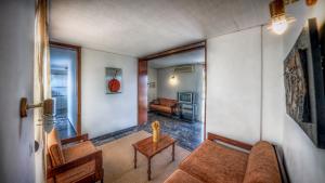 a living room with a couch and a table at Zina Hotel Apartments in Athens