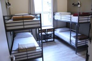 מיטה או מיטות קומותיים בחדר ב-Home Genoa Hostel