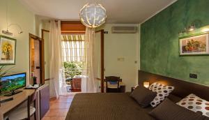 TV a/nebo společenská místnost v ubytování Hotel Gabrini