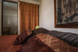 Postel nebo postele na pokoji v ubytování La muscade